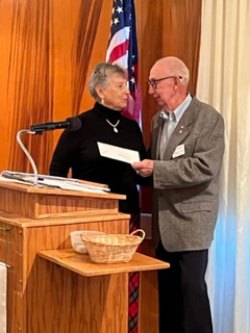 Joe Casey, of Hanford Rotary Foundation presents grant award to Marlene DiNicola, VP of Friends of the KC Library. 
